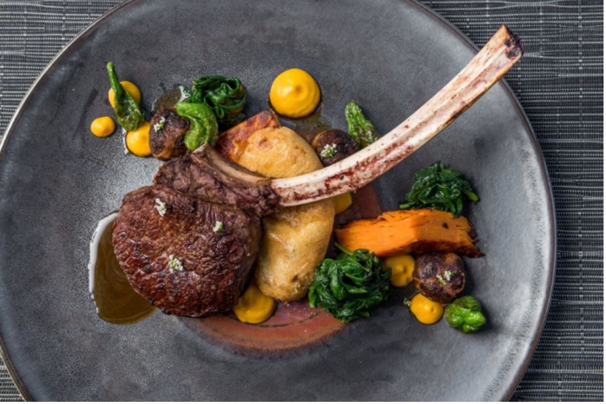 Lamb chop and sides on a plate