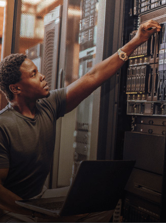 IT specialist working on a server in a server room