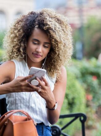 Woman looking at phone in park