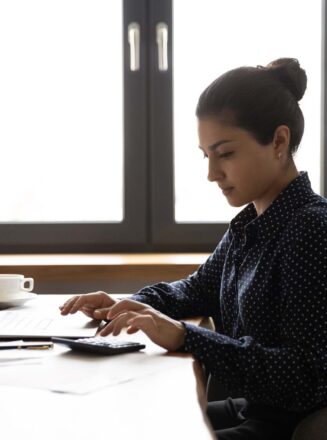 Woman Typing at Desk