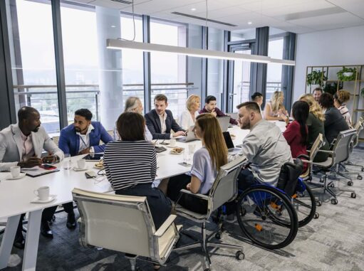 Business professionals collaborating during a team meeting in a modern conference room
